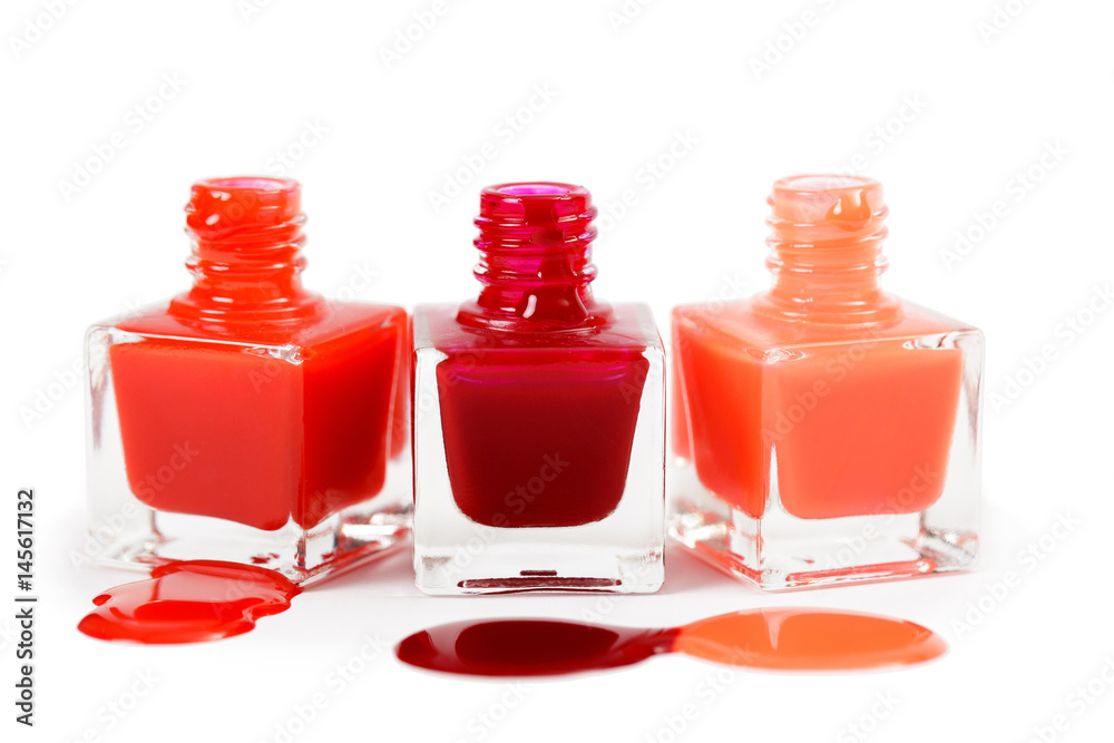 Stack of red nail polish isolated on white background Stack of red nail polish isolated on white background