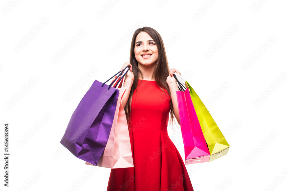 Beautiful young woman with bags, shopping concept, isolated on white background