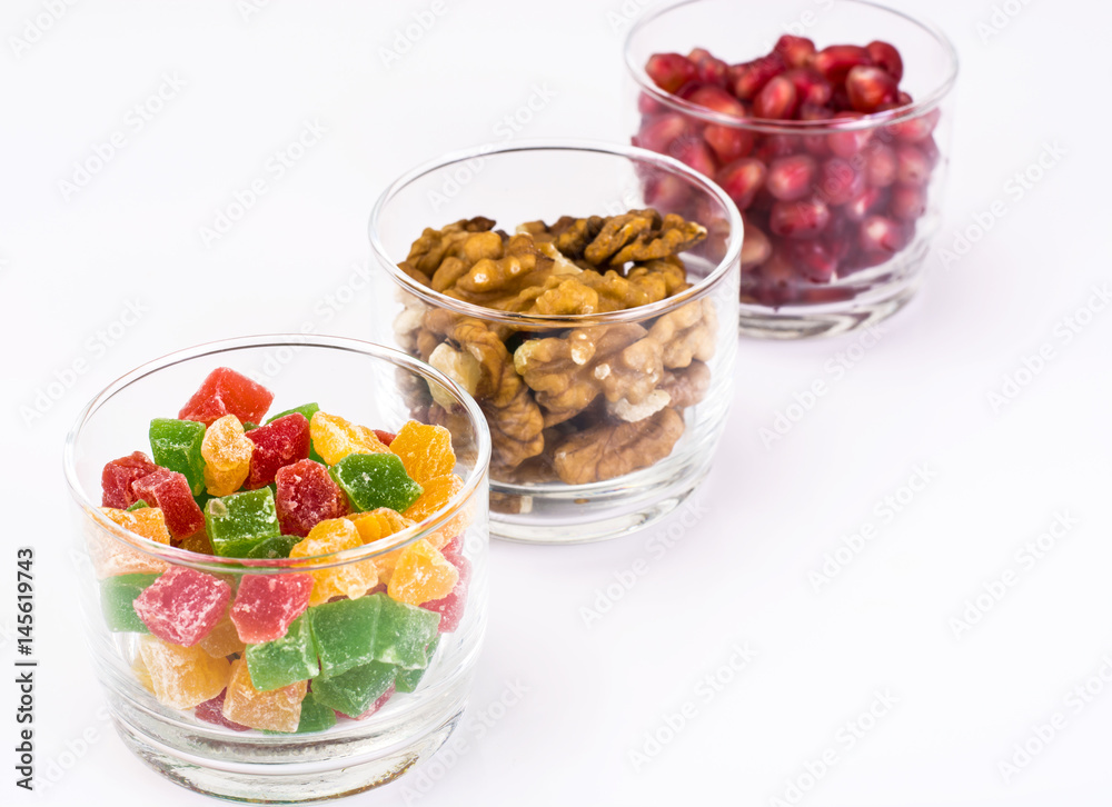 Small glass with dried fruits, nuts, pomegranate Small glass with dried fruits, nuts, pomegranate
