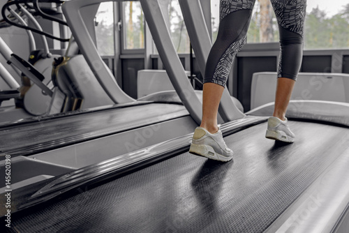 Female going on equipment in fitness center