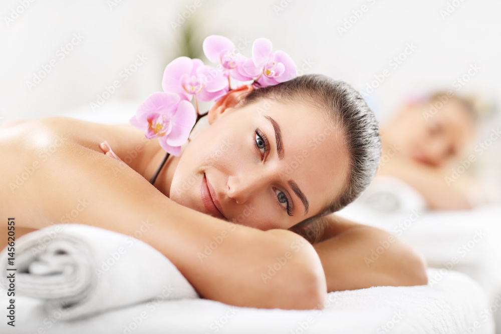 Two beautiful women getting massage in spa Two beautiful women getting massage in spa