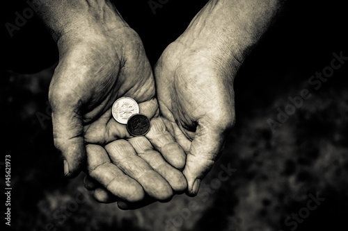 In the hands of man are different metal coins.
 photo