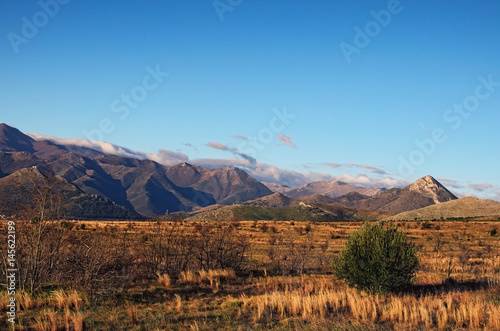 Beautiful morning landscape with mountains on a background of blue sky. Italy