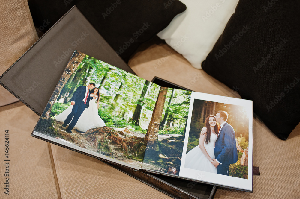 Open pages of brown luxury leather wedding book or album. Open pages of brown luxury leather wedding book or album.