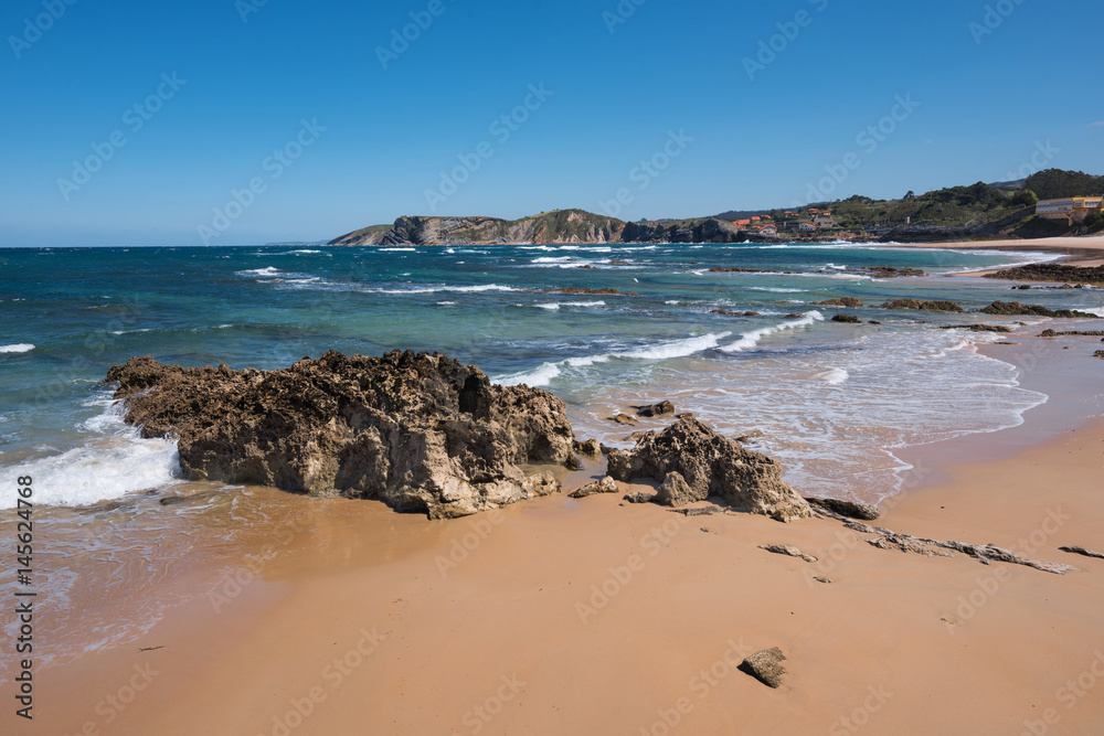Scenic beach in the touristic village of Comillas, Cantabria, Spain.