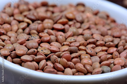 Brown lentils in a ceramic bowl