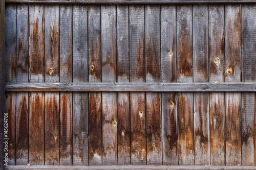 Old wooden yellowed fence, vintage background