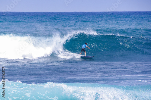 Man surfs on the waves