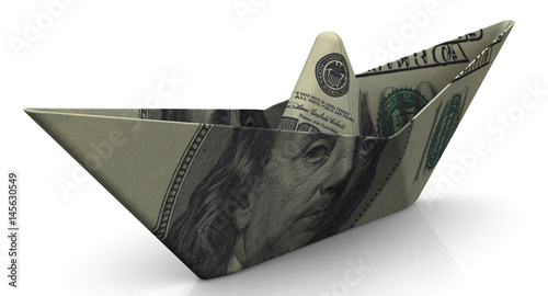 Paper boat from an American banknote on white surface photo