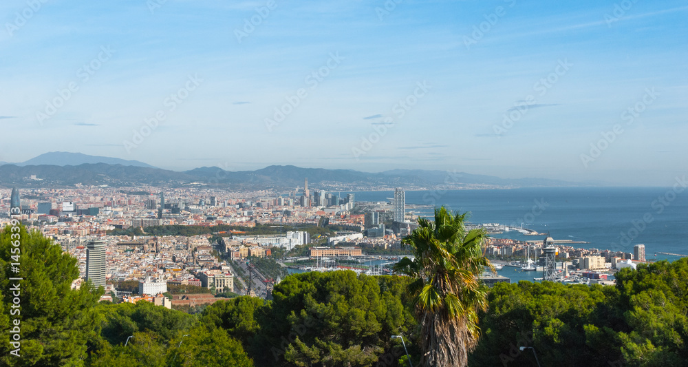 Obraz premium Beautiful Blue commerce. Coastline of Spain in seaside Barcelona. Modern city scape & coastline as seen from high level, cable car over the city. 