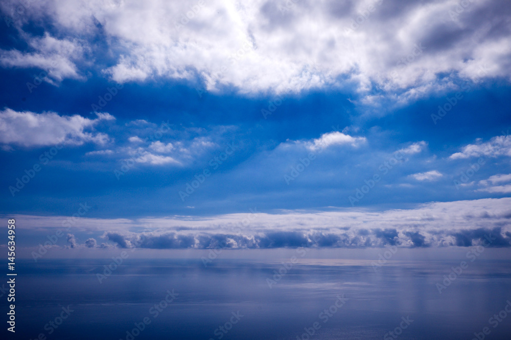 blue sky, white clouds and calm blue sea, blue and white sea scape blue sky, white clouds and calm blue sea, blue and white sea scape