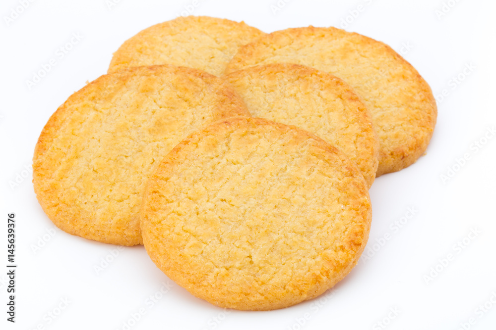 Stacked short pastry cookies isolated on white background.