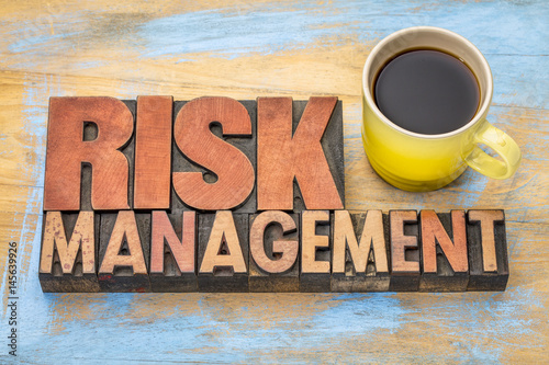 risk management banner in wood type