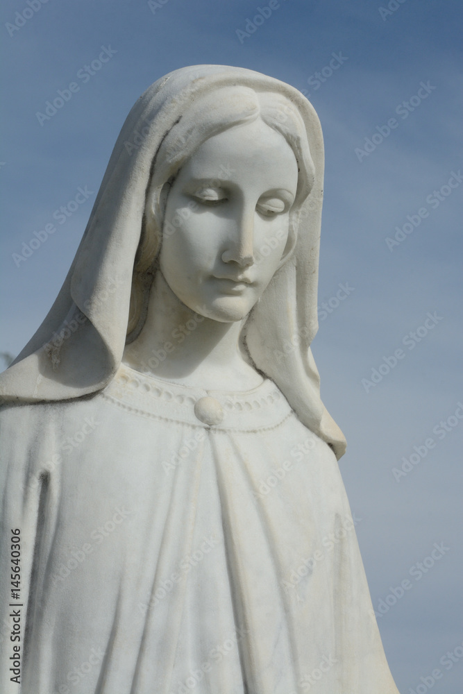 Close up of gravestone memorial of blessed Virgin Mary