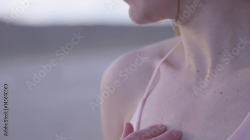 woman looking profile covered in goosebumps photo