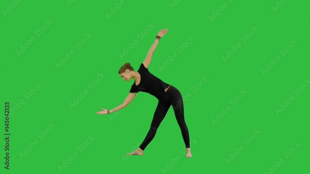 Sporty beautiful smiling young woman standing in Utthita Trikonasana, extended Triangle Pose on a Green Screen, Chroma Key Sporty beautiful smiling young woman standing in Utthita Trikonasana, extended Triangle Pose on a Green Screen, Chroma Key