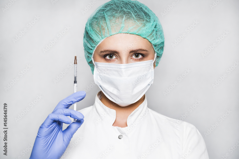 Doctor or scientist in blue gloves with syringe on white background Doctor or scientist in blue gloves with syringe on white background
