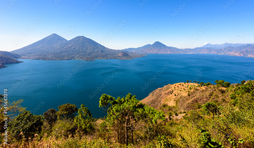 Panorama view of the lake Atitlan and volcanos in the highlands of Guatemala Panorama view of the lake Atitlan and volcanos in the highlands of Guatemala