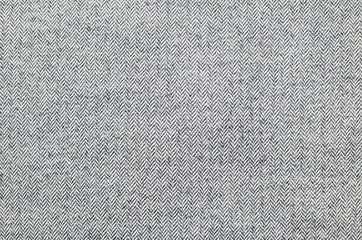 Light grey woolen or tweed fabric for grunge background