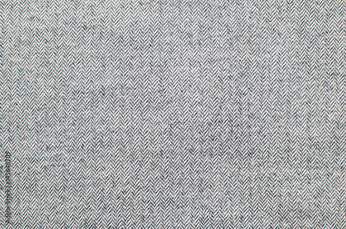Light grey woolen or tweed fabric for grunge background photo