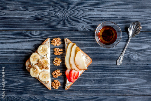 fitness breskfast with homemade sandwiches dark table background top view photo