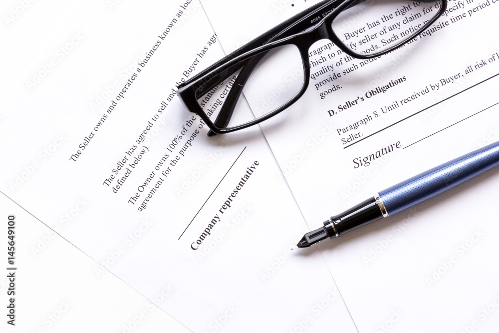office desk with signing contract, glasses and pen for business top view office desk with signing contract, glasses and pen for business top view