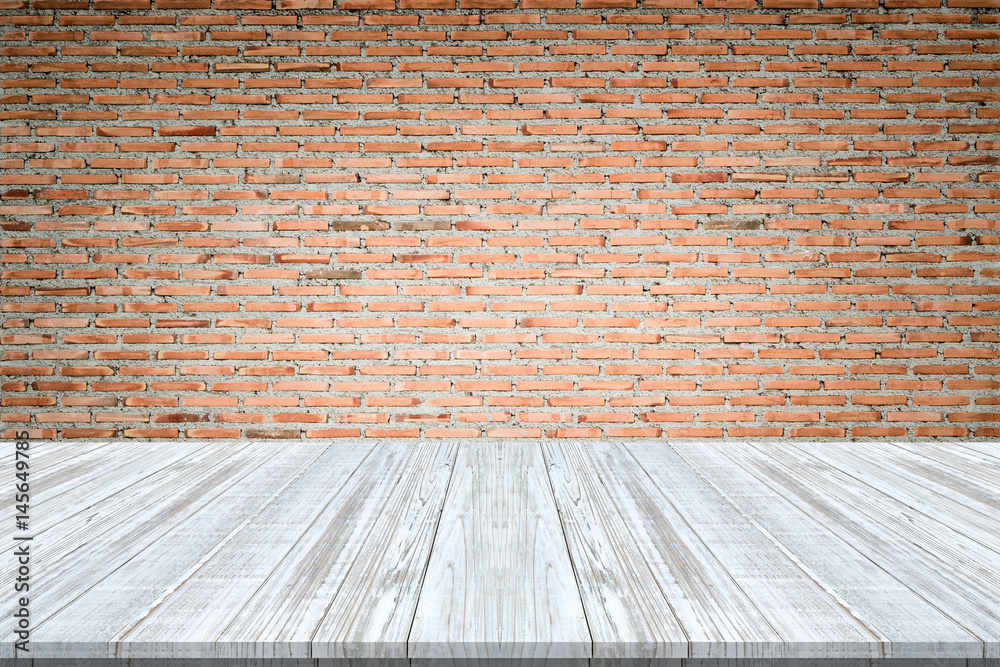 wood table top on brick wall background,Space available for the product