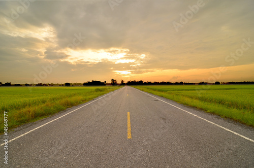 Empty asphalt road at sunset © chokniti