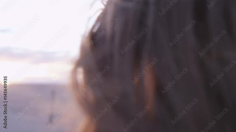 close up of red hair blowing in the wind