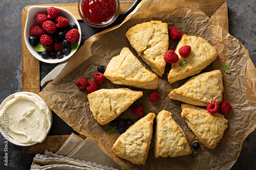 Freshly baked homemade scones with cream cheese photo