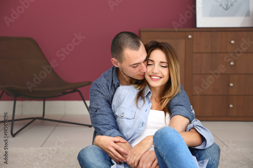 Young couple sitting togeth...