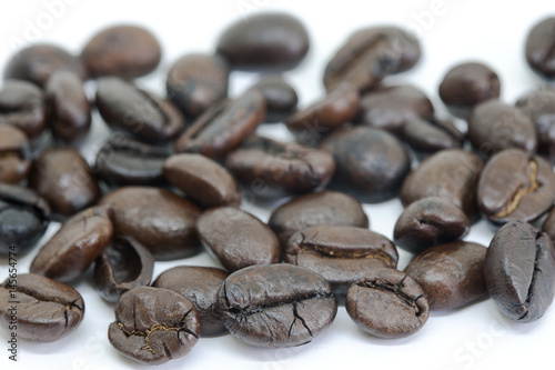 Close-up of coffee beans on white background (grain)