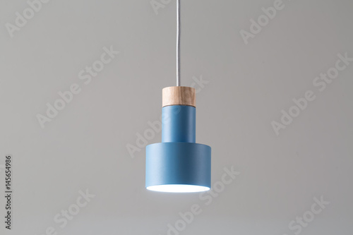 Hanging luminous blue lamp photo