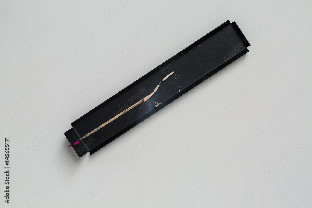 Black support with aroma stick Black support with aroma stick