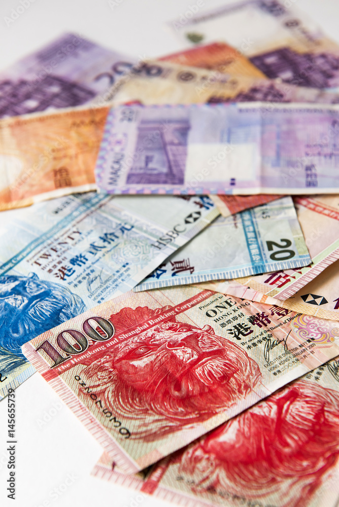 Fototapeta premium Stacked of Hong Kong and Macau Dollar bills,close up