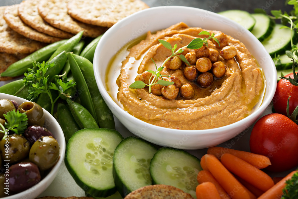 Tableau sur toile Hummus and vegetables platter with grain salad