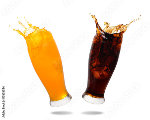 Couple soft drink splashing out of glass isolated on white background.