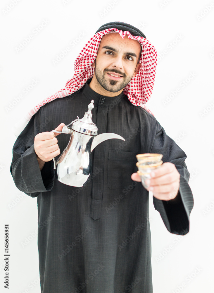 Gulf Arabian young man with traditional coffee Gulf Arabian young man with traditional coffee