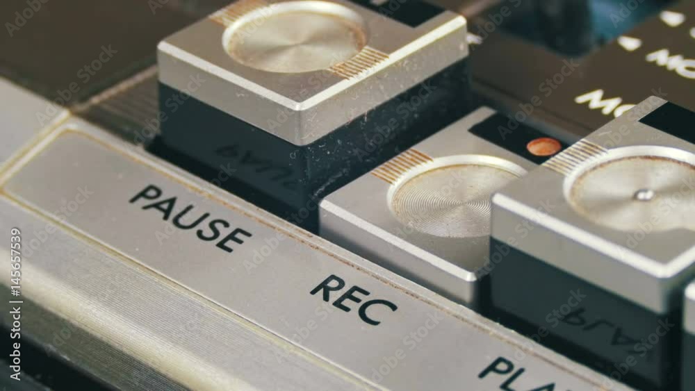Pushing Record Button on a Vintage Tape Recorder. Closeup. Pushing a Finger Button Record. Man