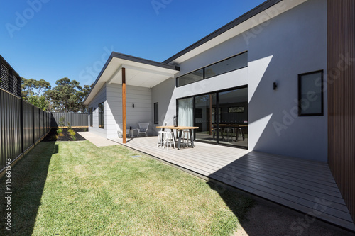 Canvastavla Outdoor entertaining deck and lawn of a new home