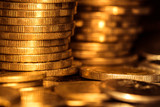 gold money coin stacking on dark background
