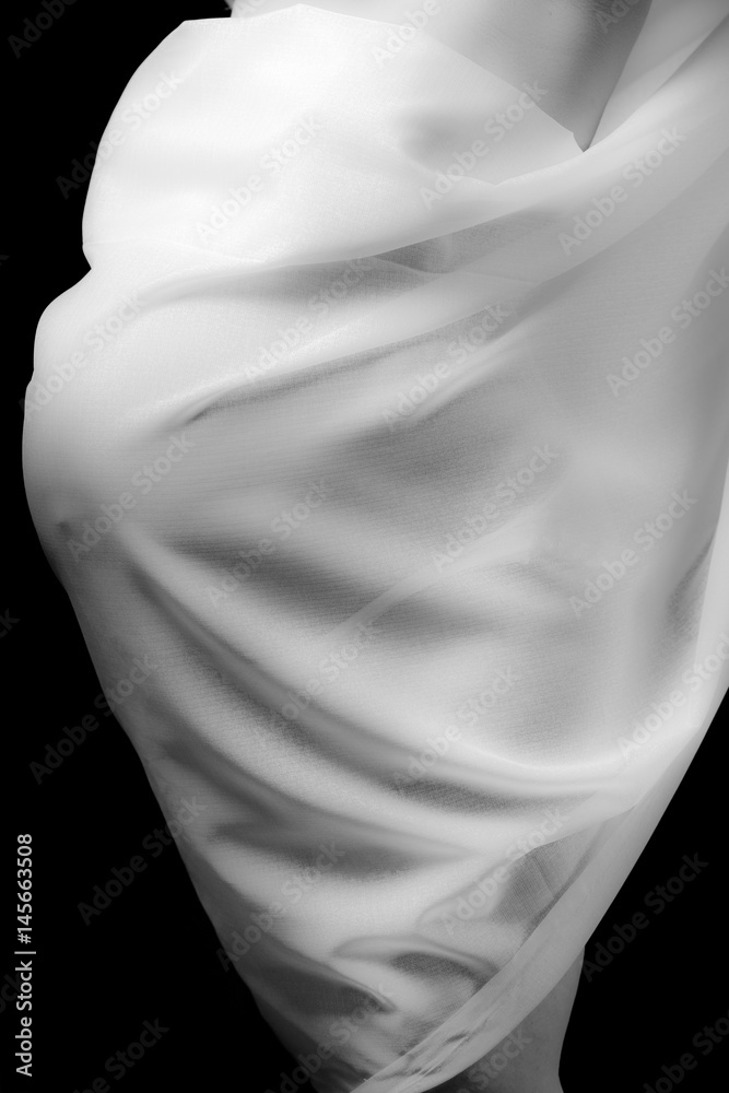Pregnant women covered with cloth in black and white