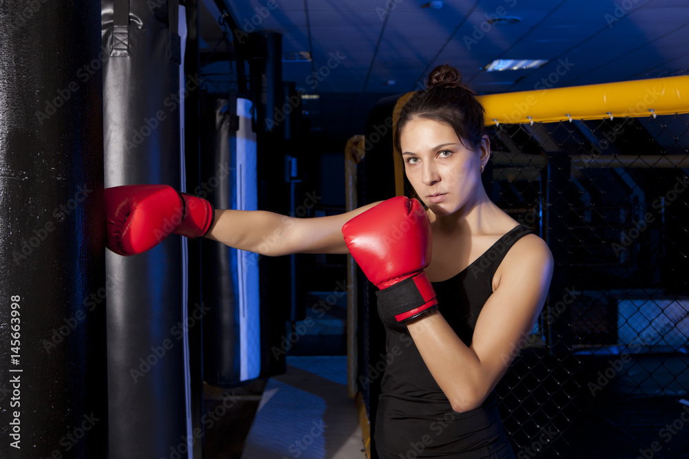 Woman training gym boxing mma ring