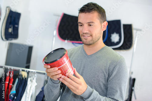 Man looking at product in equestrian store