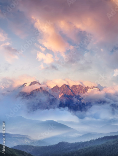 Fototapeta Naklejka Na Ścianę i Meble -  Mountain range in the clouds. Beautiful natural landscape