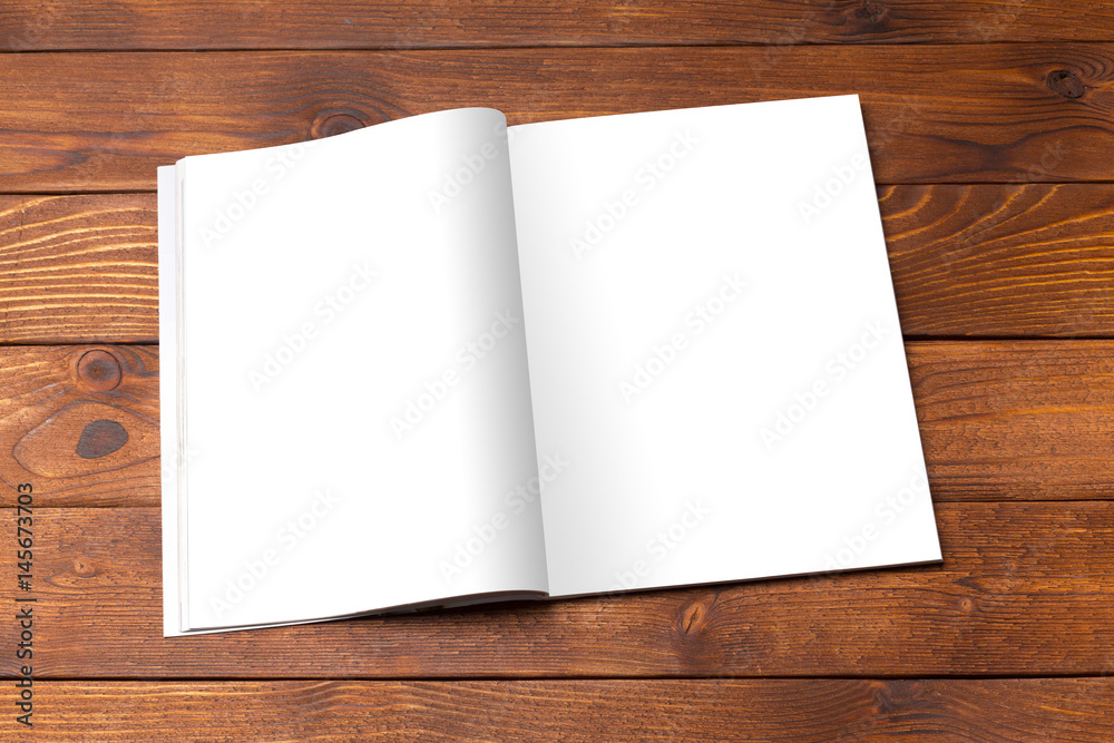 Blank book or magazine cover on wood background Blank book or magazine cover on wood background