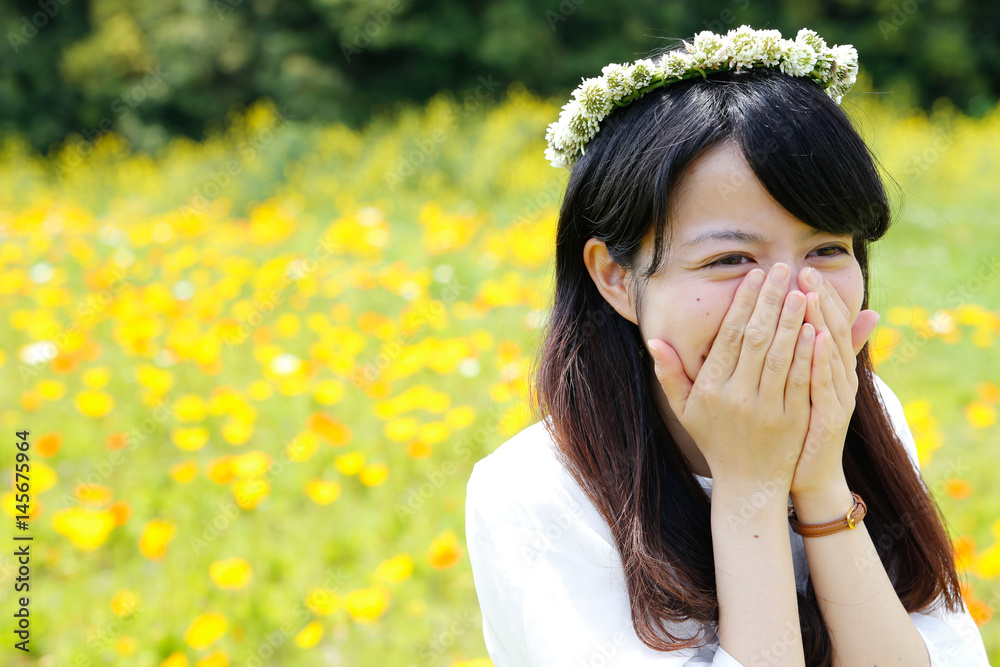 young Japanese lady in Flower garden young Japanese lady in Flower garden