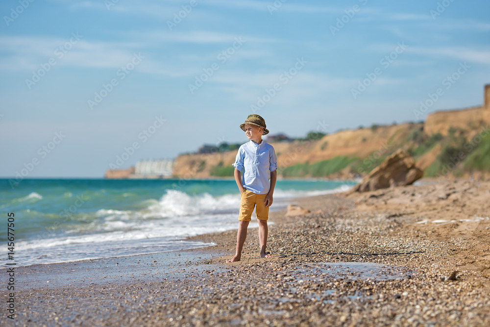fashion boy on the beach
