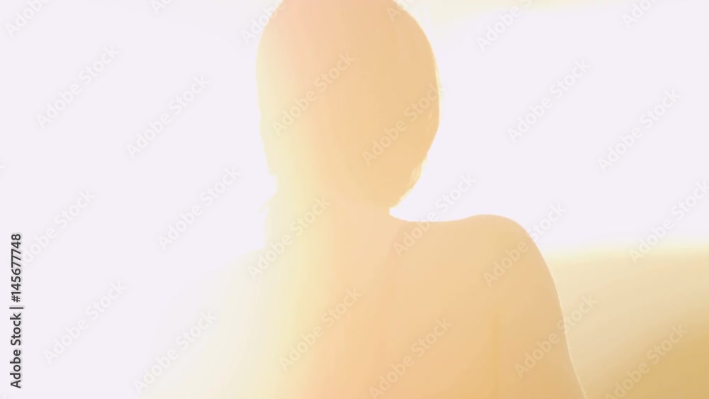 slow motion close up of girl staring at sun set