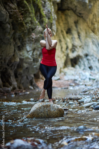 Young woman doing yoga outdoor